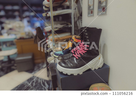 Second-hand clothing store Boots on display 111056216