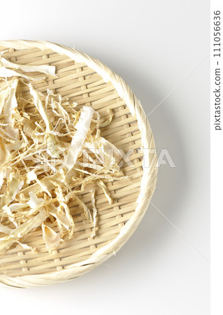 Dried radish skin photographed against a white background Dried radish skin photographed against a white background 111056636