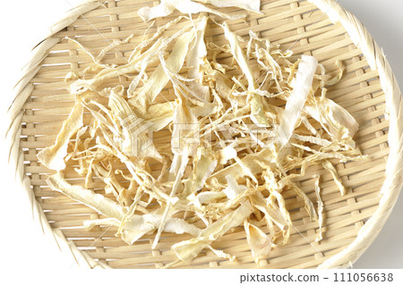 Dried radish skin photographed against a white background Dried radish skin photographed against a white background 111056638