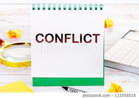 The conflict text is written on a notepad on the manager's desk 111058528