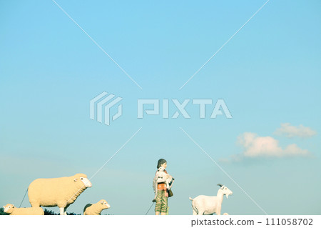 boy, goat and sheep 111058702