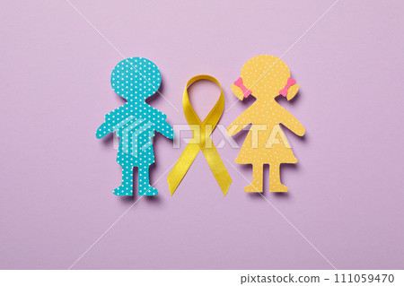 Paper figures of children with a yellow ribbon Paper figures of children with a yellow ribbon 111059470