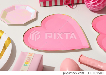 A pink heart-shaped plate on a light background. 111059500