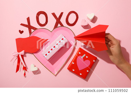 Flat lay plate in the shape of a heart on a pink background. Flat lay plate in the shape of a heart on a pink background. 111059502