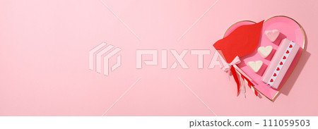 Flat lay plate in the shape of a heart on a pink background. Flat lay plate in the shape of a heart on a pink background. 111059503
