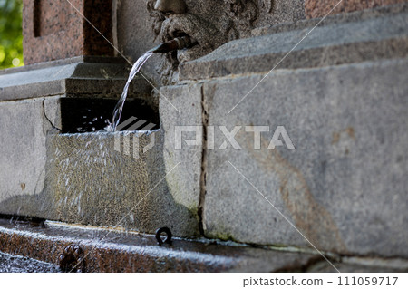 water flowing through a fountain. 111059717
