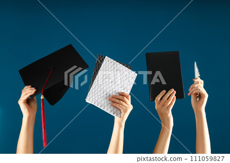 Things of a student who is getting an education in the hands of women. 111059827