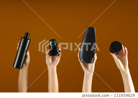 Hygiene products in the hands of women, on a bright background. 111059829