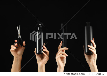 Hairdressing tools and products in female hands. 111059837