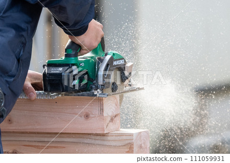 Carpentry work using a circular saw 111059931