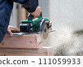Carpentry work using a circular saw 111059933