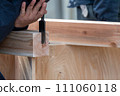 Carpentry work with a chisel 111060118