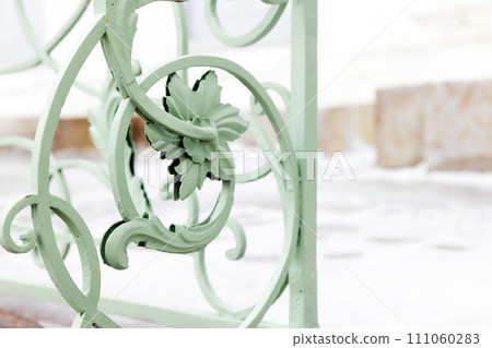 Vintage green forged railings with floral decoration design elements Vintage green forged railings with floral decoration design elements 111060283