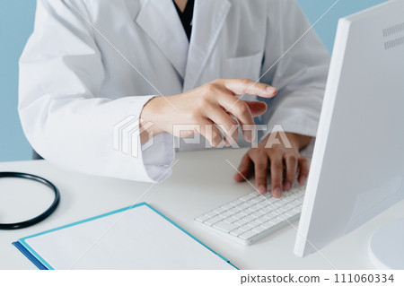 Hand of a male doctor in a white coat Hand of a male doctor in a white coat 111060334