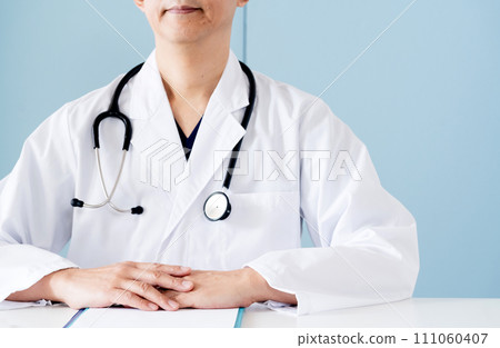 Male doctor in white coat Male doctor in white coat 111060407
