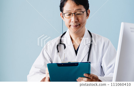 Male doctor in white coat Male doctor in white coat 111060410