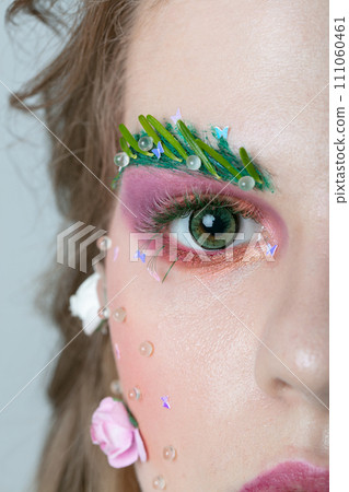 Portrait of a beautiful girl with creative make-up 111060461