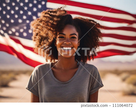 Portrait of a happy beautiful black girl with curly hair against the background of the USA flag in the desert Portrait of a happy beautiful black girl with curly hair against the background of the USA flag in the desert 111064072
