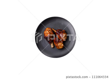 Delicious grilled chicken legs with spices and herbs in teriyaki sauce 111064334