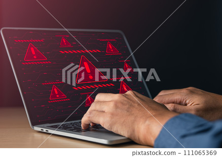 Businessman using laptop with red warning alert system hacked screen. System alert for virus,spam,scam and phishing. Cyber security, data security system concept. Businessman using laptop with red warning alert system hacked screen. System alert for virus,spam,scam and phishing. Cyber security, data security system concept. 111065369