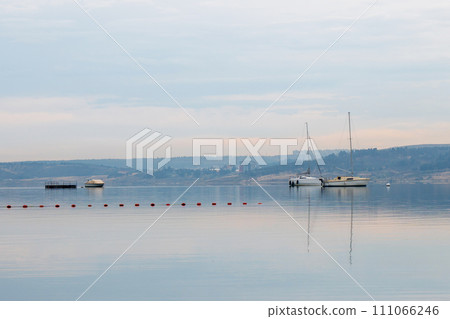 Tbilisi sea, reservoir and boats with deflated sails Tbilisi sea, reservoir and boats with deflated sails 111066246