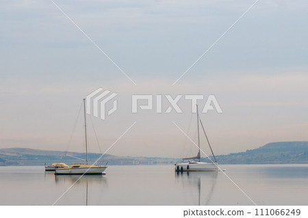 Tbilisi sea, reservoir and boats with deflated sails Tbilisi sea, reservoir and boats with deflated sails 111066249