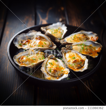 Oysters baked with cheese on plate. Homemade creamy oysters rockefeller with cheese. 111066362
