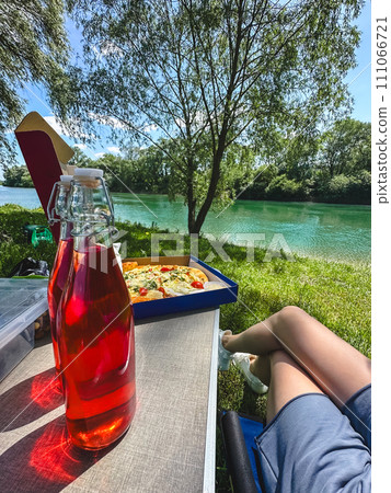 pizza with drink in bottle at portable table ar riverside pizza with drink in bottle at portable table ar riverside 111066721