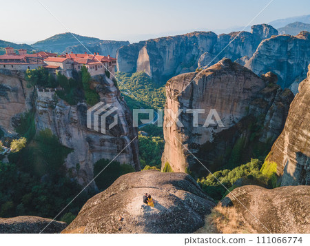 couple traveler sitting on the top of the mountain 111066774