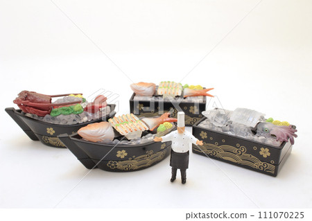 a scale japanese sashimi platter, fresh sashimi set on ice with chef 111070225