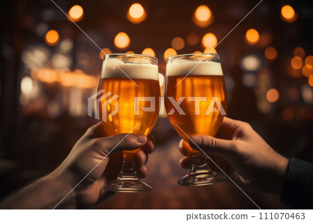 Two friends drink light beer in a pub. Close-up. 111070463