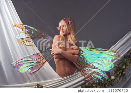 Sensual female butterfly just crawled out of her cocoon 111070720