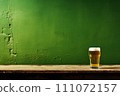 Cold beer glass on green background. St. Patricks day banner for irish pub promotions 111072157