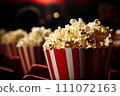 Delicious Fresh Popcorn with Copy Space in Cinema, Perfect Snack for Movie Night and Entertainment 111072163