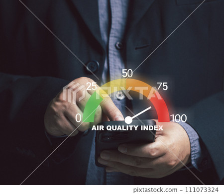 Businessman pointing at virtual screen measuring. concept of pm2.5 indicator weather air on mobile phone. air pollution and dust. health care, environment. Air Quality index. 111073324