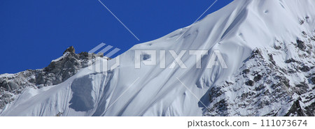 Detail of a snow covered glacier and peak near Gorak Shep, Nepal. Detail of a snow covered glacier and peak near Gorak Shep, Nepal. 111073674