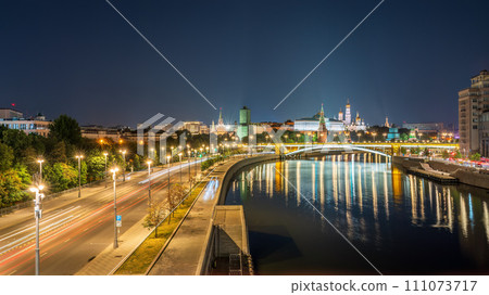 Illuminated Moscow Kremlin and Bolshoy Kamenny Bridge at summer night. View from the Patriarshy pedestrian Bridge 111073717