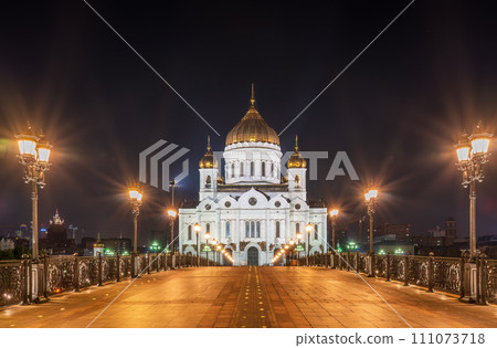Cathedral of Christ the Savior and Patriarshy bridge at night in Moscow, Russia Cathedral of Christ the Savior and Patriarshy bridge at night in Moscow, Russia 111073718