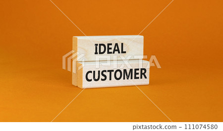 Ideal customer symbol. Concept words Ideal customer on beautiful wooden blocks. Beautiful orange table orange background. Business ideal customer concept. Copy space. Ideal customer symbol. Concept words Ideal customer on beautiful wooden blocks. Beautiful orange table orange background. Business ideal customer concept. Copy space. 111074580