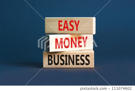 Easy money business symbol. Concept words Easy money business on beautiful wooden blocks. Beautiful grey table grey background. Easy money business concept. Copy space. 111074602