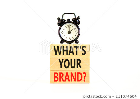 Branding and what is your brand symbol. Concept words What is your brand on beautiful blocks. Beautiful white background. Black alarm clock. Business branding what is your brand concept. Copy space. 111074604