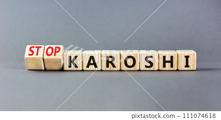 Stop karoshi symbol. Concept words Karoshi or Stop karoshi on beautiful wooden blocks. Beautiful grey table grey background. Business and stop karoshi concept. Copy space. Stop karoshi symbol. Concept words Karoshi or Stop karoshi on beautiful wooden blocks. Beautiful grey table grey background. Business and stop karoshi concept. Copy space. 111074618