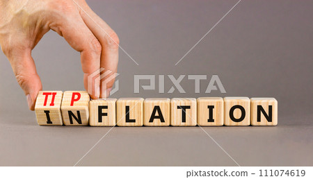 Inflation or tipflation symbol. Concept words Inflation Tipflation on beautiful wooden blocks. Beautiful grey background. Businessman hand. Business inflation Tipflation concept. Copy space 111074619