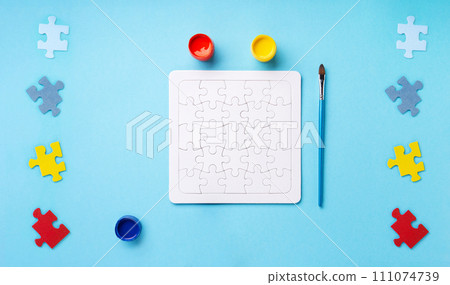 World Autism Awareness Day Card, colorful Puzzles on Blue Background. World Autism Awareness Day Card, colorful Puzzles on Blue Background. 111074739