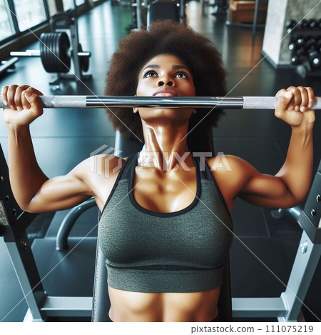 A woman working on bench press (front) 111075219