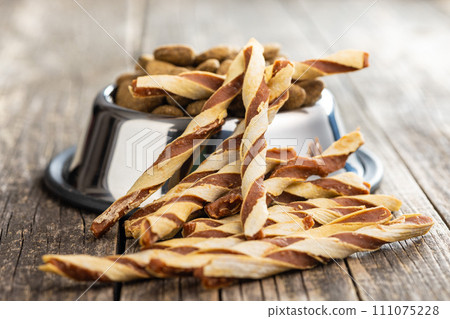 Dog food. Snack sticks for dogs on wooden table. Dog food. Snack sticks for dogs on wooden table. 111075228