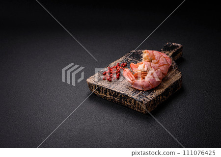 Delicious shrimp or langoustine tails boiled with salt and spices Delicious shrimp or langoustine tails boiled with salt and spices 111076425