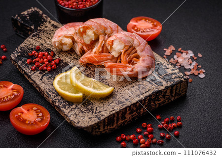 Delicious shrimp or langoustine tails boiled with salt and spices 111076432