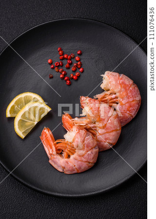 Delicious shrimp or langoustine tails boiled with salt and spices Delicious shrimp or langoustine tails boiled with salt and spices 111076436