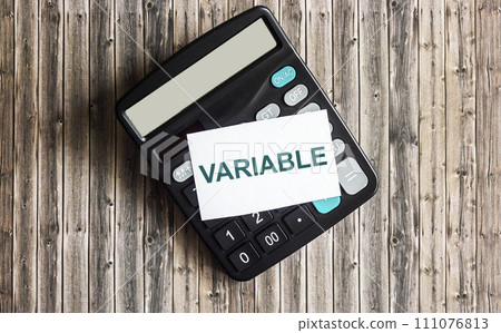 text The variable is written on a sticky note placed on the calculator. Variable universal text The variable is written on a sticky note placed on the calculator. Variable universal 111076813